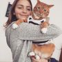 Cat doesn't seem to enjoy his new wardrobe.